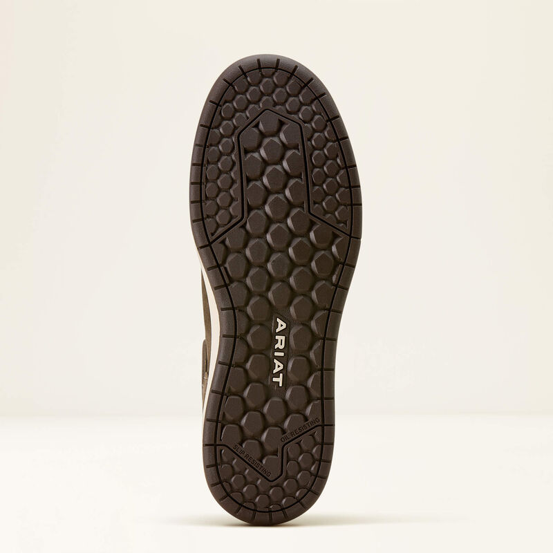 Close-up of a shoe sole with Ariat branding on a beige background