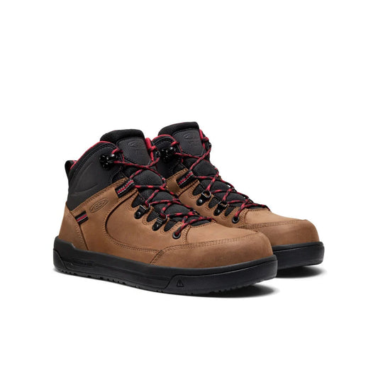 Pair of brown hiking boots with black and red laces on a white background