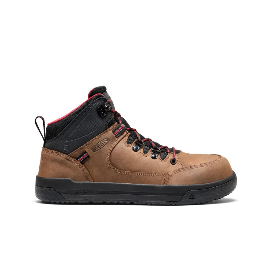 Brown hiking boot with black sole on a white background